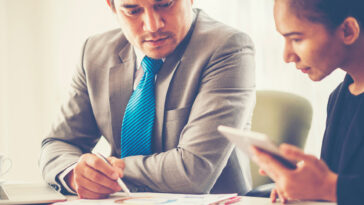 Two business people closing a deal