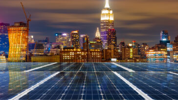 The NYC skyline showing buildings with environmentally-conscious solar panels