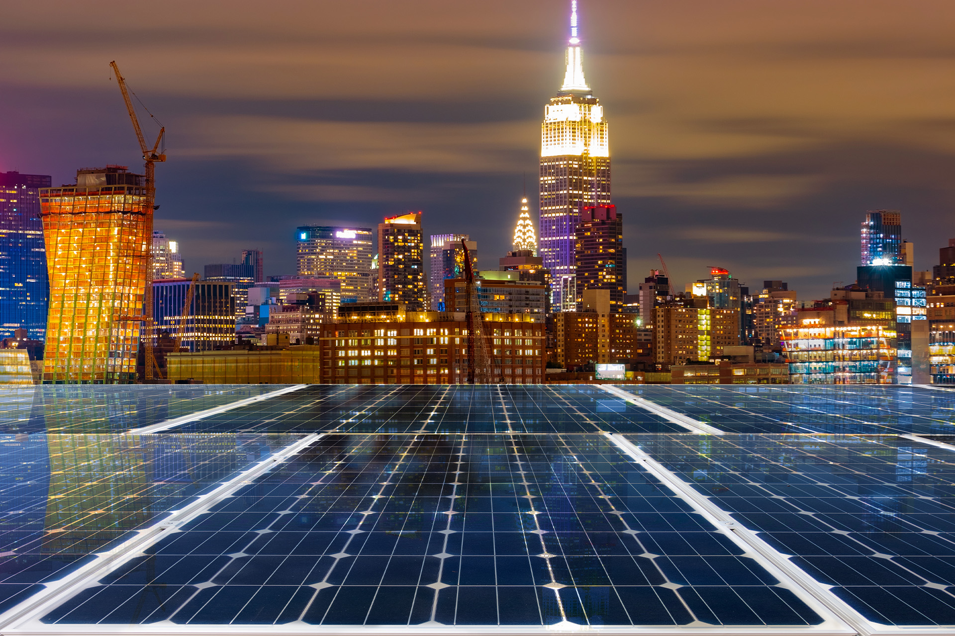 The NYC skyline showing buildings with environmentally-conscious solar panels